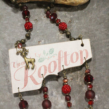 Load image into Gallery viewer, The Primitive Peddler Up On A Rooftop Dangle Drop Reindeer Necklace
